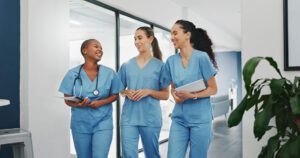 Nurses conversing on a break — nurse depression and anxiety can worsen if they are not allowed to take sufficient breaks and have social support.