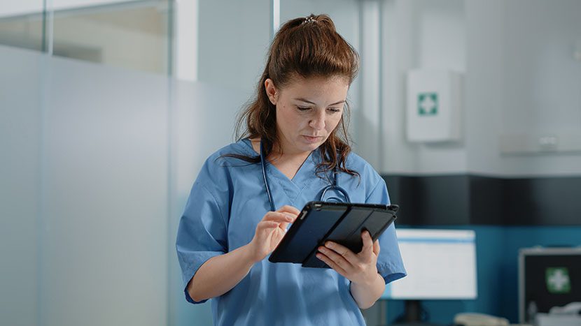 nurse using digital tablet with touch screen